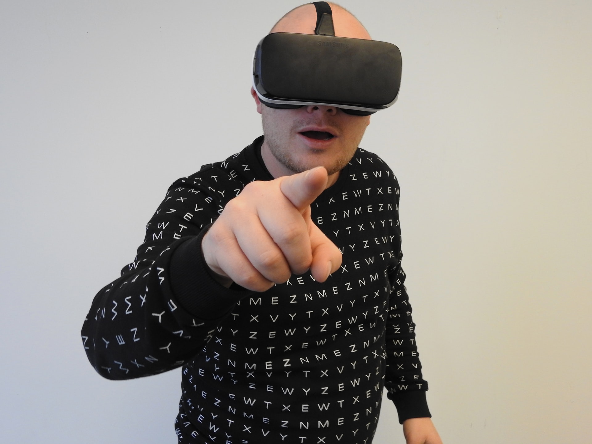 Man in VR headset. Photo by @hammerandtusk via Unsplash