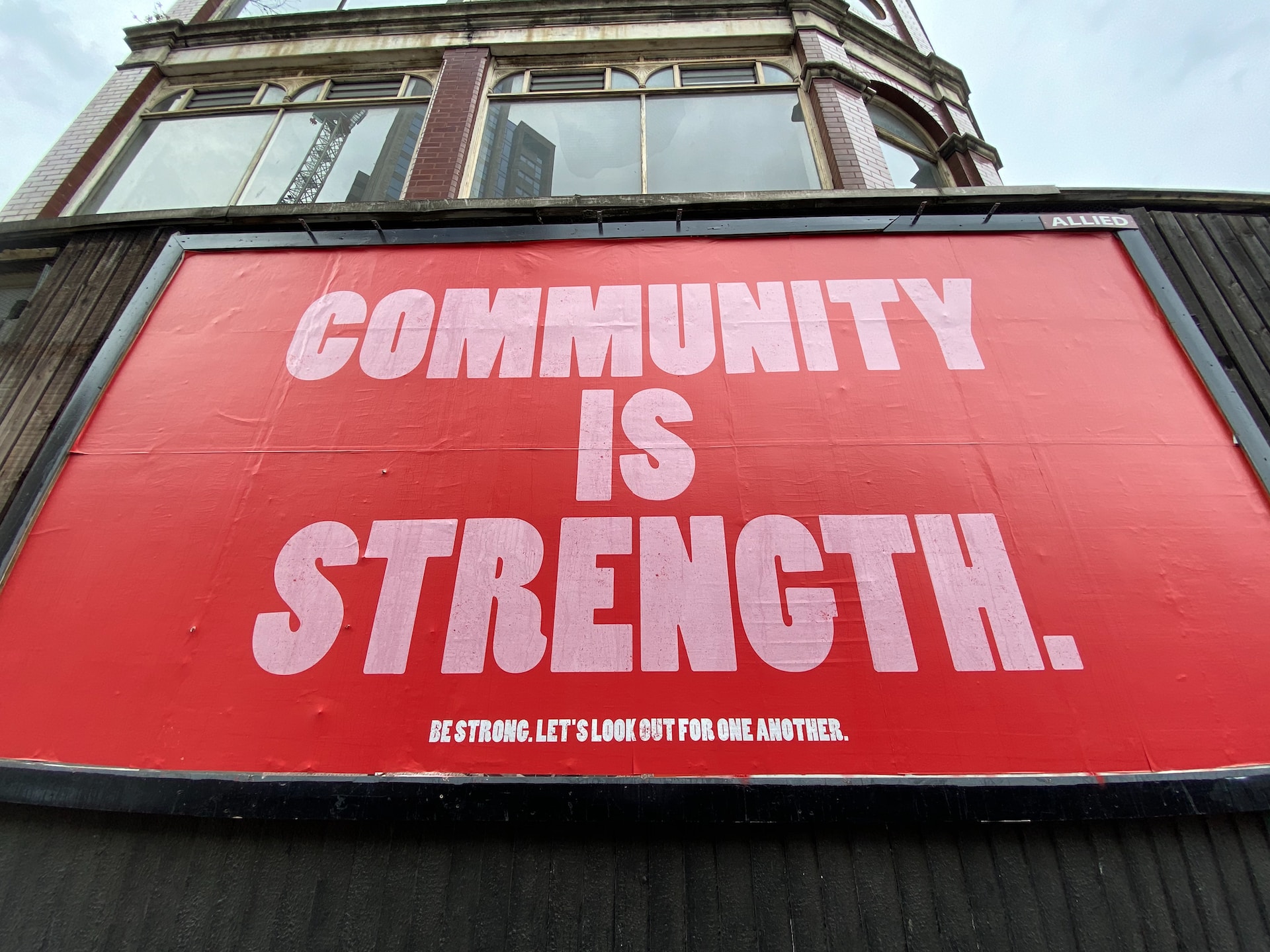 'Community is Strength' writ large on a billboard. 