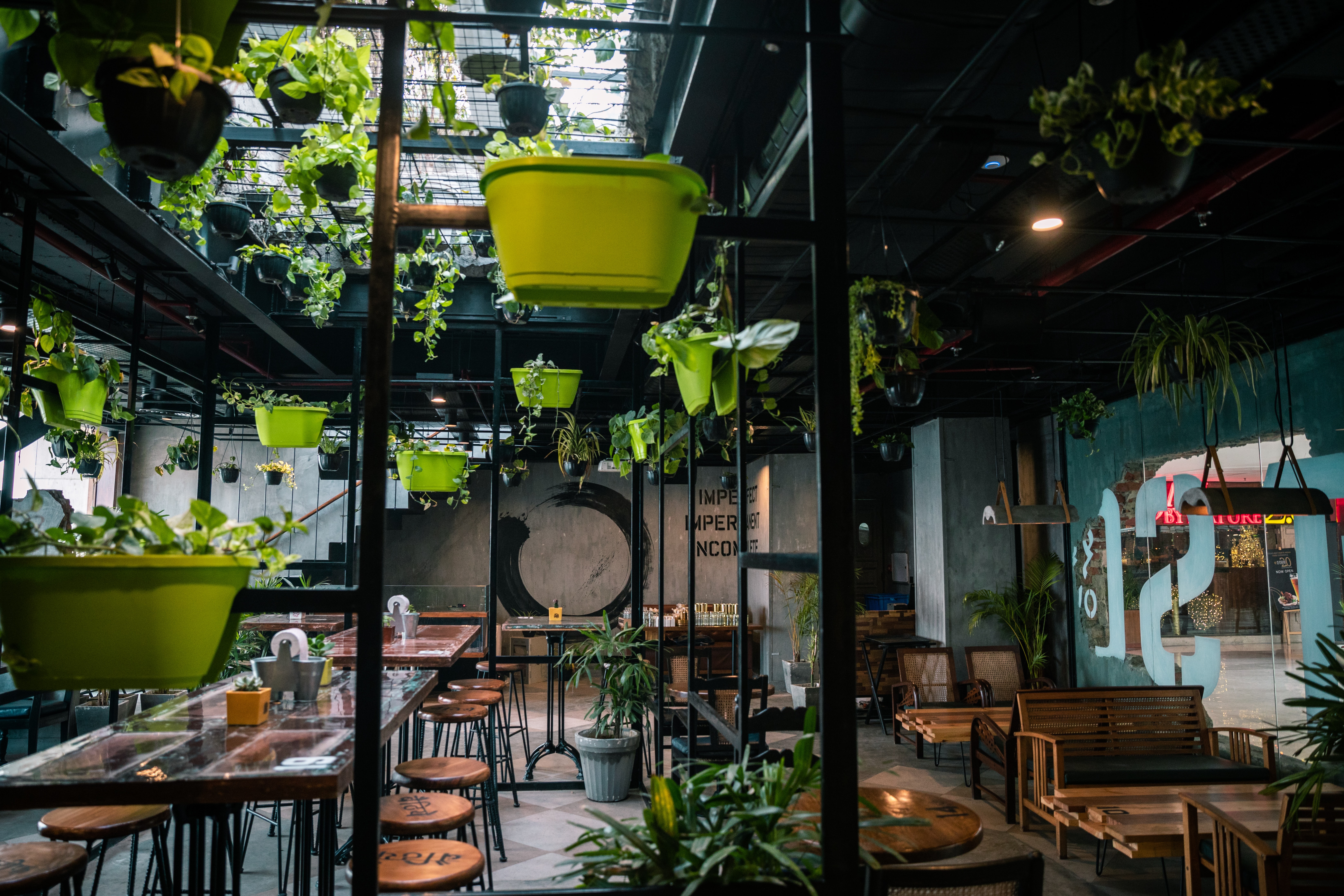 Flexible workspace with lots of wooden seating and plants